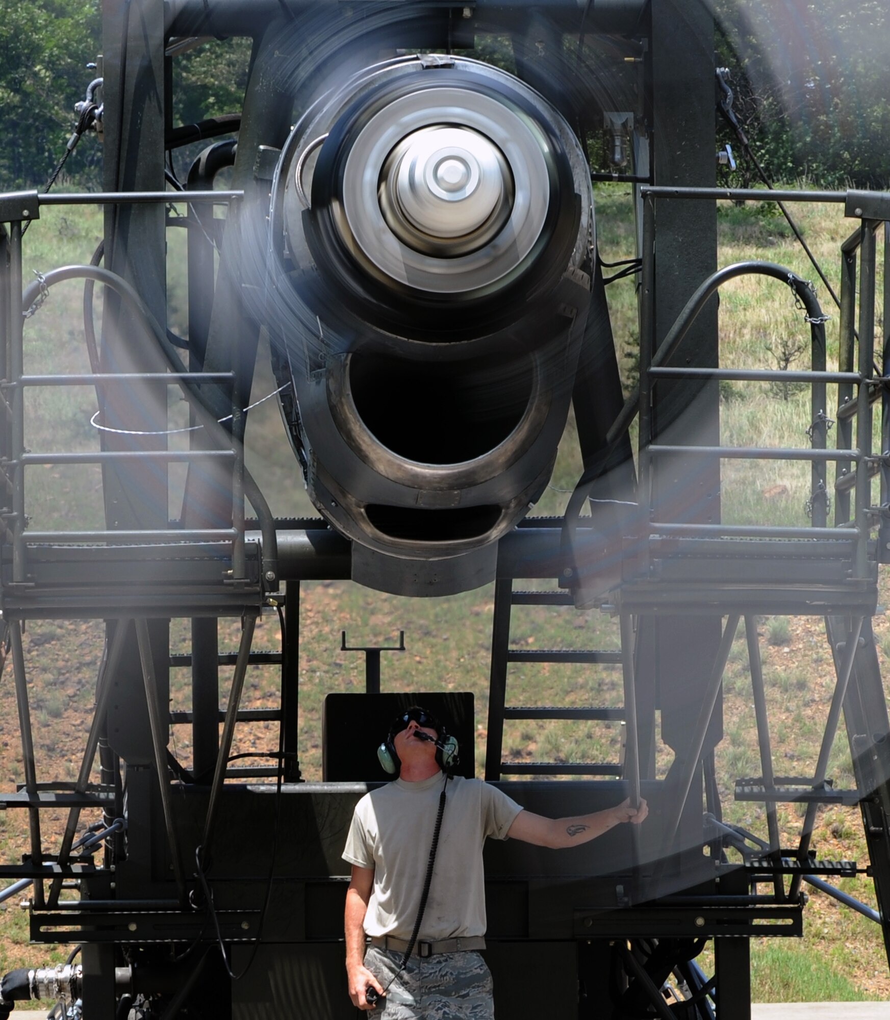 Tech. Sgt. Jeremy Leuch, 19th Component Maintenance Squadron test cell NCO-in-charge, checks for oil leaks during a performance check on a C-130 engine May 25, 2011, at Little Rock Air Force Base, Ark. A C-130 engine performance check is a two-day process before the engine is sent back to the engine shop for final inspection. (U.S. Air Force photo by Airman 1st Class Rusty Frank)
