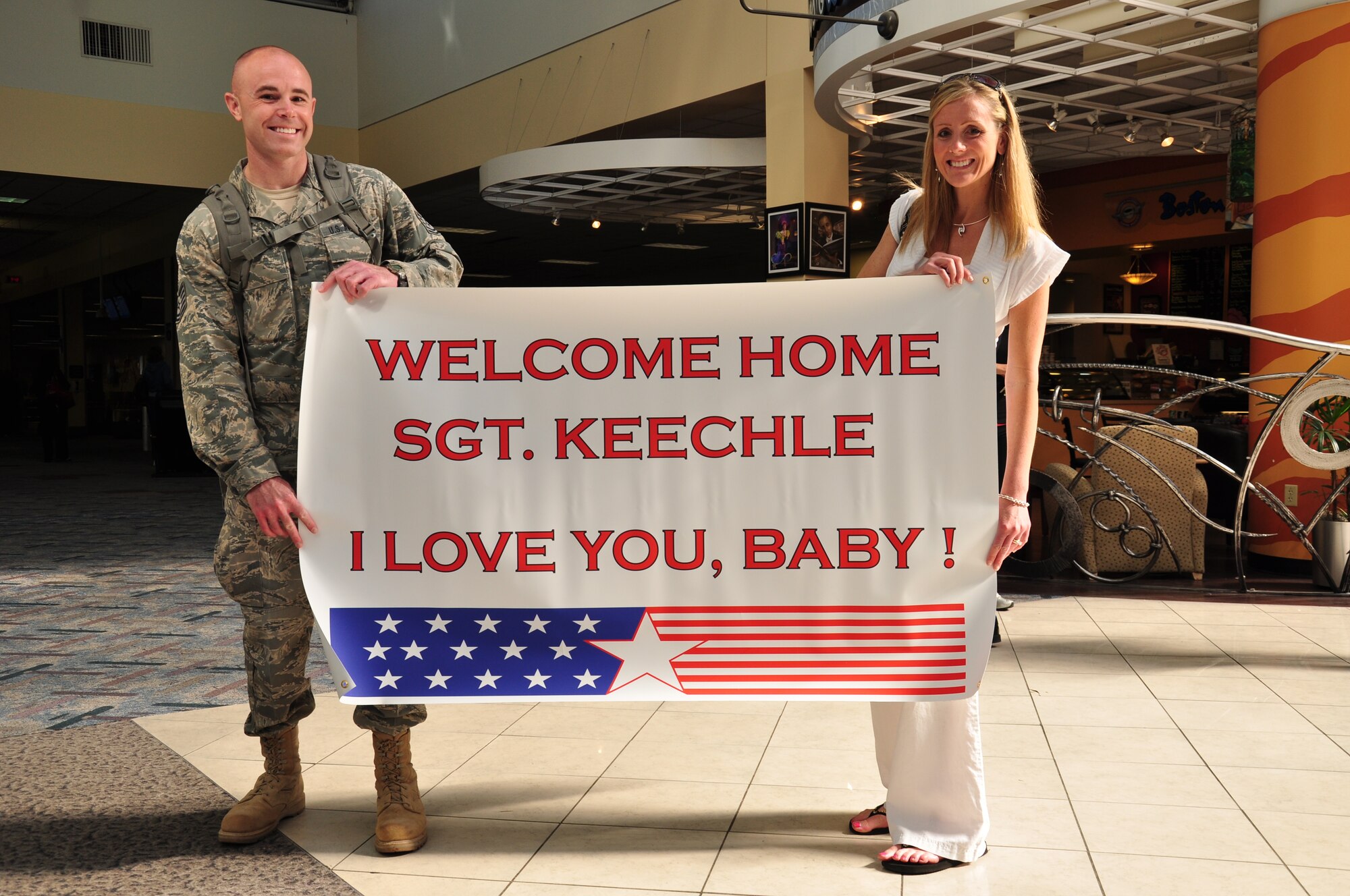 WRIGHT-PATTERSON AIR FORCE BASE, Ohio – Tech. Sgt. Mathew Keechle, 87th Aerial Port Squadron, receives a warm welcome from family and friends upon his return to the Dayton International Airport May 20 after a 4-month deployment to Southwest Asia. (U.S. Air Force photo/Senior Airman Mikhail Berlin)