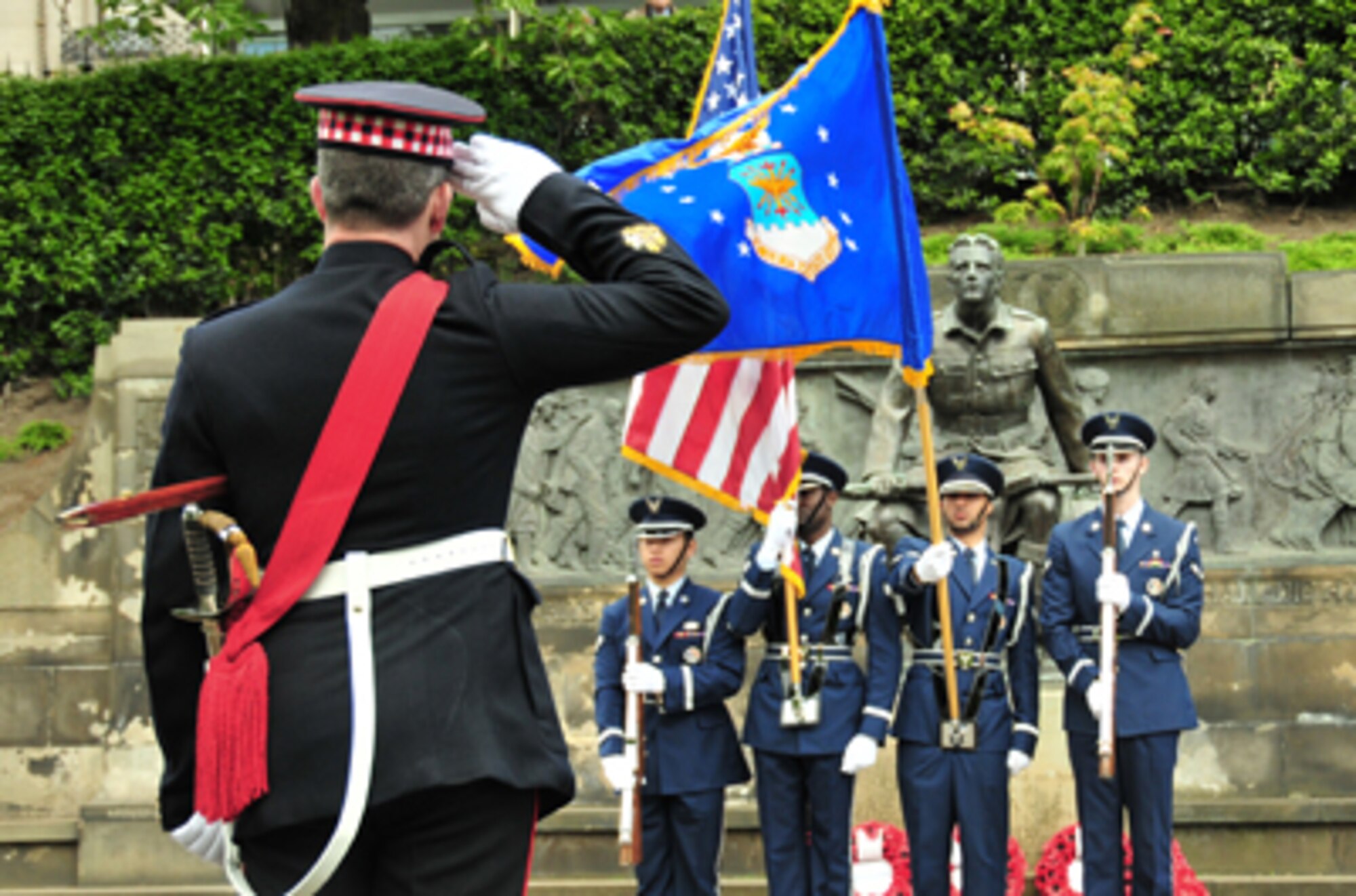 Garrison Sgt. Maj. Graham White salutes the 48th Fighter Wing Honor Guard during a Memorial Day ceremony honoring fallen heroes at the Scottish-American War Memorial May 30, 2011, in Edinburgh, Scotland. This year marks the 77th annual Scottish-American Memorial Day service at "The Call," a war memorial presented to the Scottish people by the U.S., as a tribute to World War I Scottish troops. Sergeant White is assigned to Headquarters Edinburgh Garrison, Edinburgh Castle. (U.S. Air Force photo/Staff Sgt. Megan P. Lyon) 