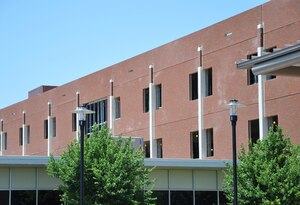 Contractors completed the installation of 45 energy-efficient brick panels on the south side of the east wing of USAF Hospital Langley at Langley Air Force Base, Va., May 30. As a result, hospital administrators will not relocate the emergency room and related services during weekends as initially planned. (U.S. Air Force photo by Senior Airman Jason J. Brown/Released)