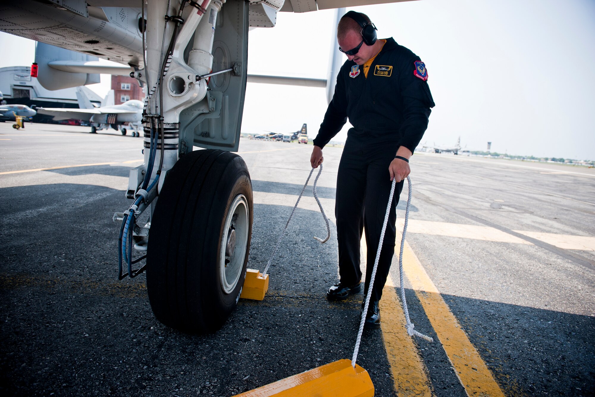 REPUBLIC AIRPORT, N.Y. -- Senior Airman Kyle Myers, A-10 East Demonstration Team crew chief, removes chalks from an A-10C Thunderbolt II in preparation for an air show May 28. The demo team alternates maintenance crews every other air show. During air shows that occur back-to-back, one crew sometimes returns home as the other is leaving out the door. (U.S. Air Force photo/Staff Sgt. Jamal D. Sutter)(RELEASED)