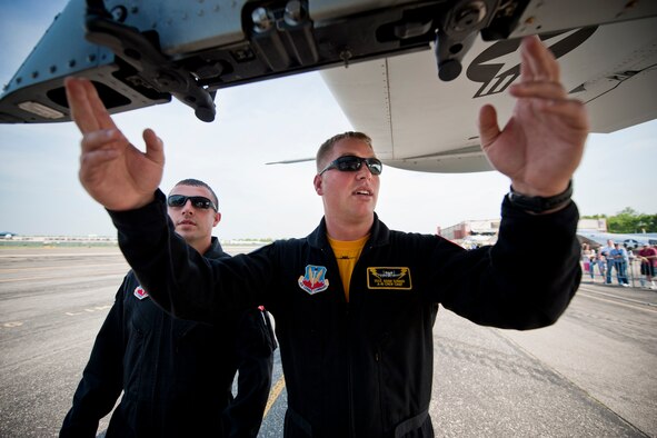 Staff Sgt. Adam Sunner, A-10 East Demonstration Team crew chief, explains launch procedures to Staff Sgt. Benjamin McIntosh, A-10 East Demo Team engine specialist, in preparation for an air show at Long Island, N.Y., May 28. The launch was Sergeant McIntosh’s first during an air show; typically he either narrates or performs videotaping duties. (U.S. Air Force photo by Staff Sgt. Jamal D. Sutter/Released)