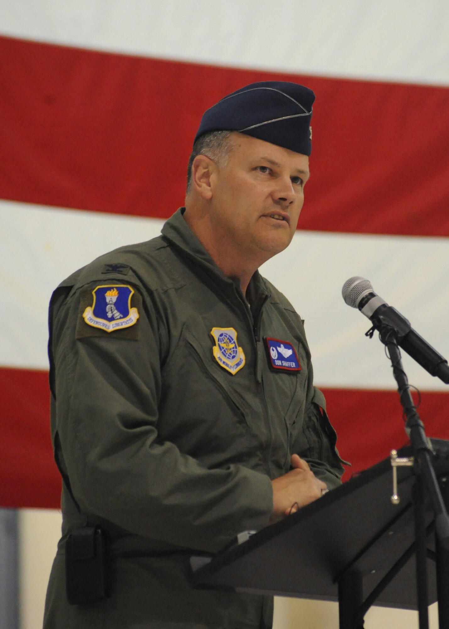 Col. Don Shaffer, 319th Air Base Wing commander, shares opening remarks June 1 during the arrival ceremony of the RQ-4 Global Hawk to the base. The arrival marked the beginning of a new era of remotely piloted aircraft at the base, which will be maintained under Detachment 1, 9th Reconnaissance Wing. (U.S. Air Force photo by Staff Sgt. Suellyn Nuckolls)