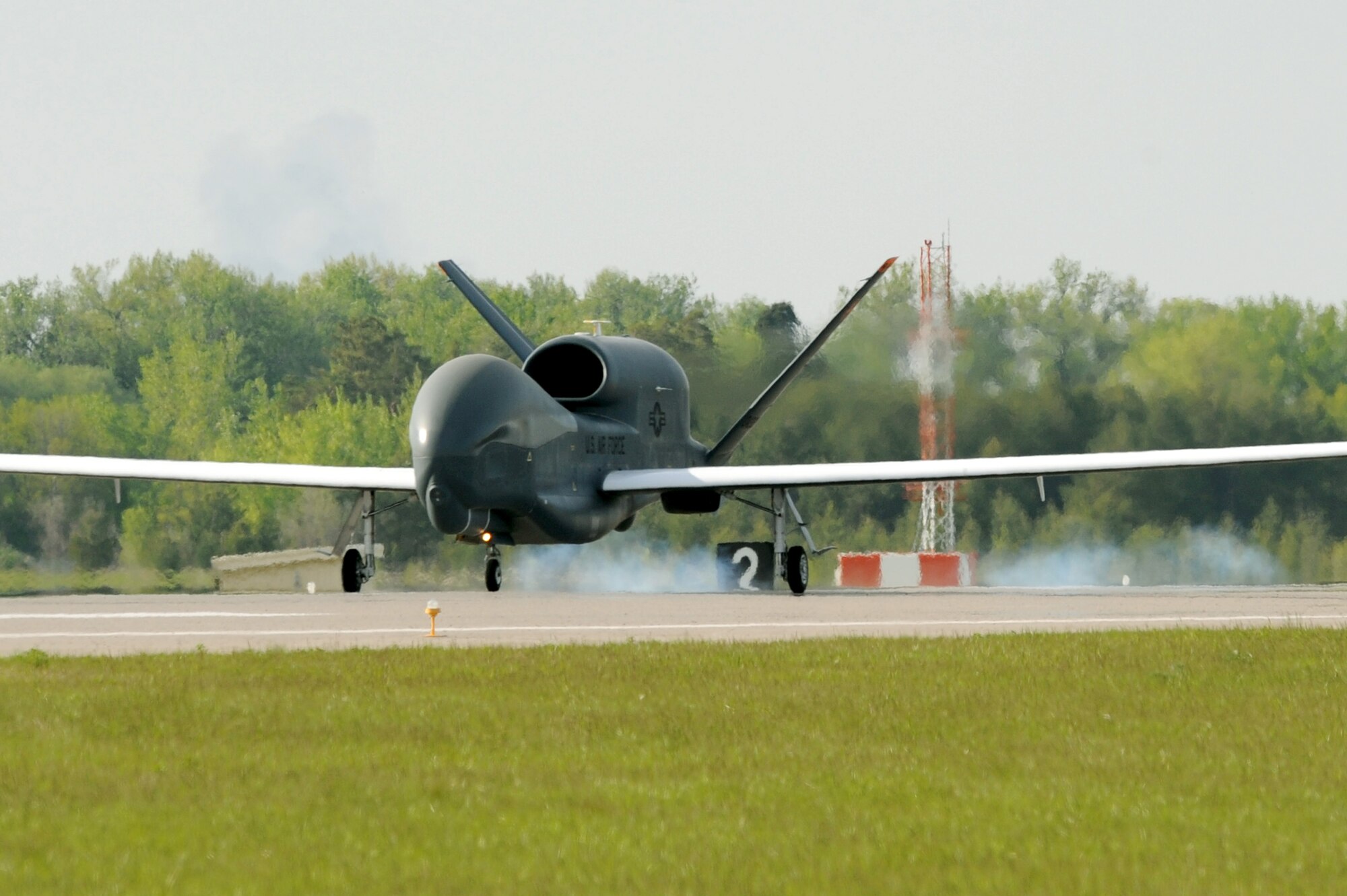 The first RQ-4 Global Hawk arrives to Grand Forks Air Force Base May 26. The arrival marked the beginning of a new era of remotely piloted aircraft at the base, which will be maintained under Detachment 1, 9th Reconnaissance Wing. (U.S. Air Force photo by Tech. Sgt. Johnny Saldivar)