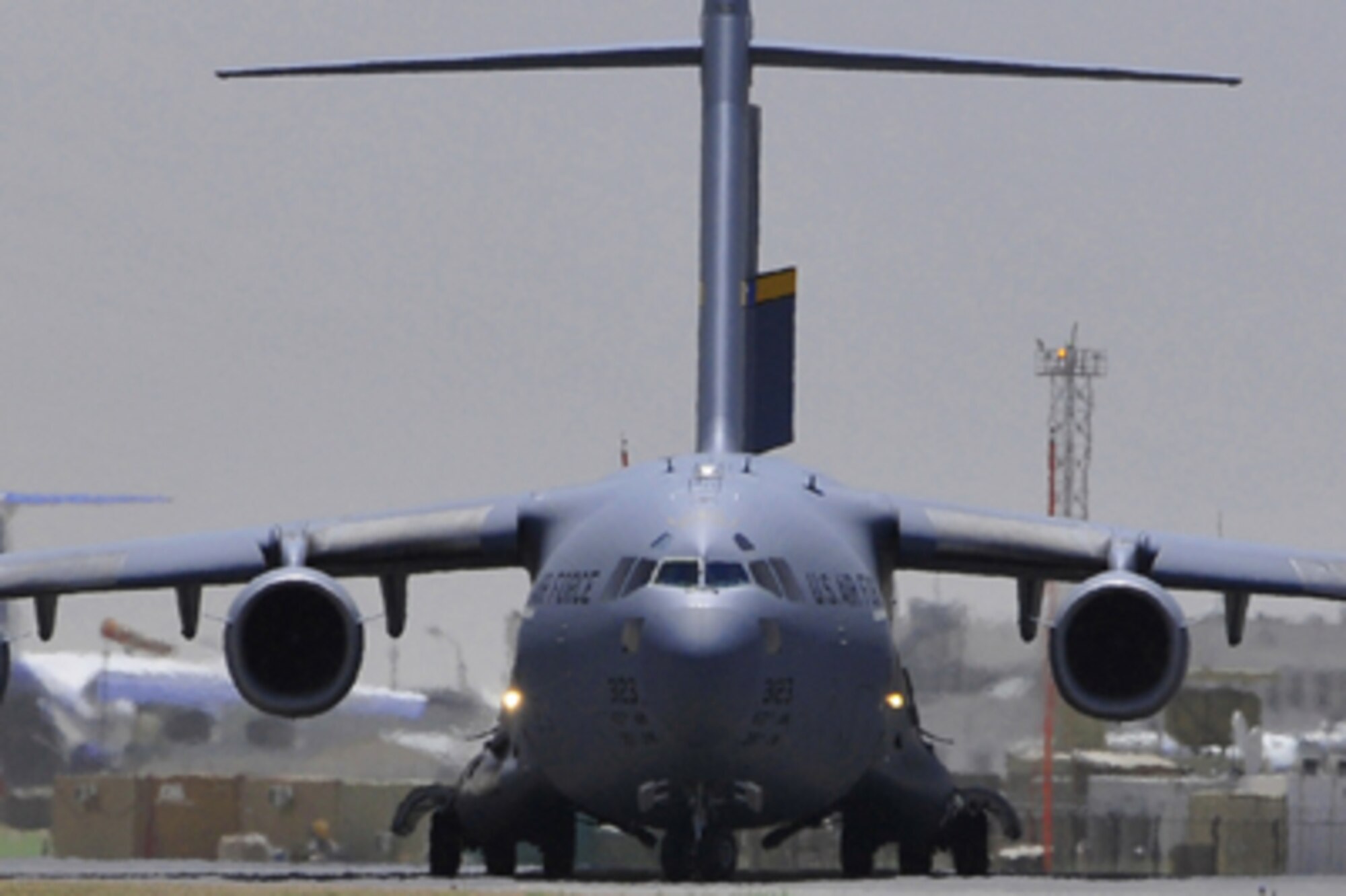 A C-17 Globemaster III lands at Kabul International Airport June 1, 2011, in Kabul, Afghanistan. The C-17 recently landed for the first time at Shindand Air Base marking the first time the large military aircraft landed at the base since the refurbished runway opened in December 2010. (U.S. Air Force photo/Senior Airman Amber Williams) 