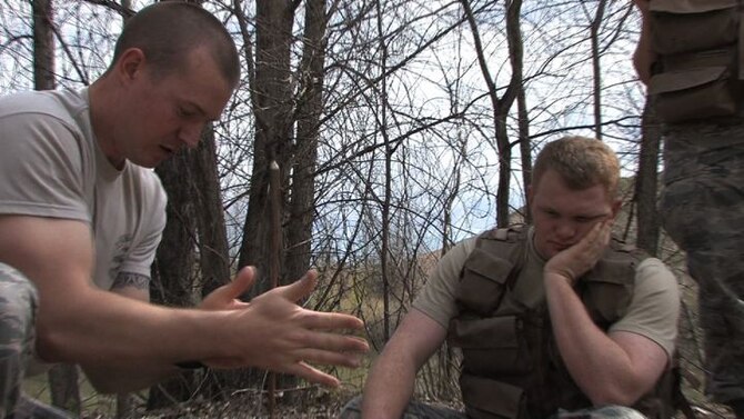 The 934th Operations Group, SERE (Search, Escape, Survival and Evasion) 

instructor, Staff Sgt. Adam Craft conducts survival skill techniques at the Arden 

Hills training area with aircrew members from the 934th Aeromedical 

Evacuation Squadron. Survival skills training is required for all aircrew members. (Air Force Photo/Wendy Cormier)

Their focus was prioritizing their needs, navigation and fire starting techniques.
