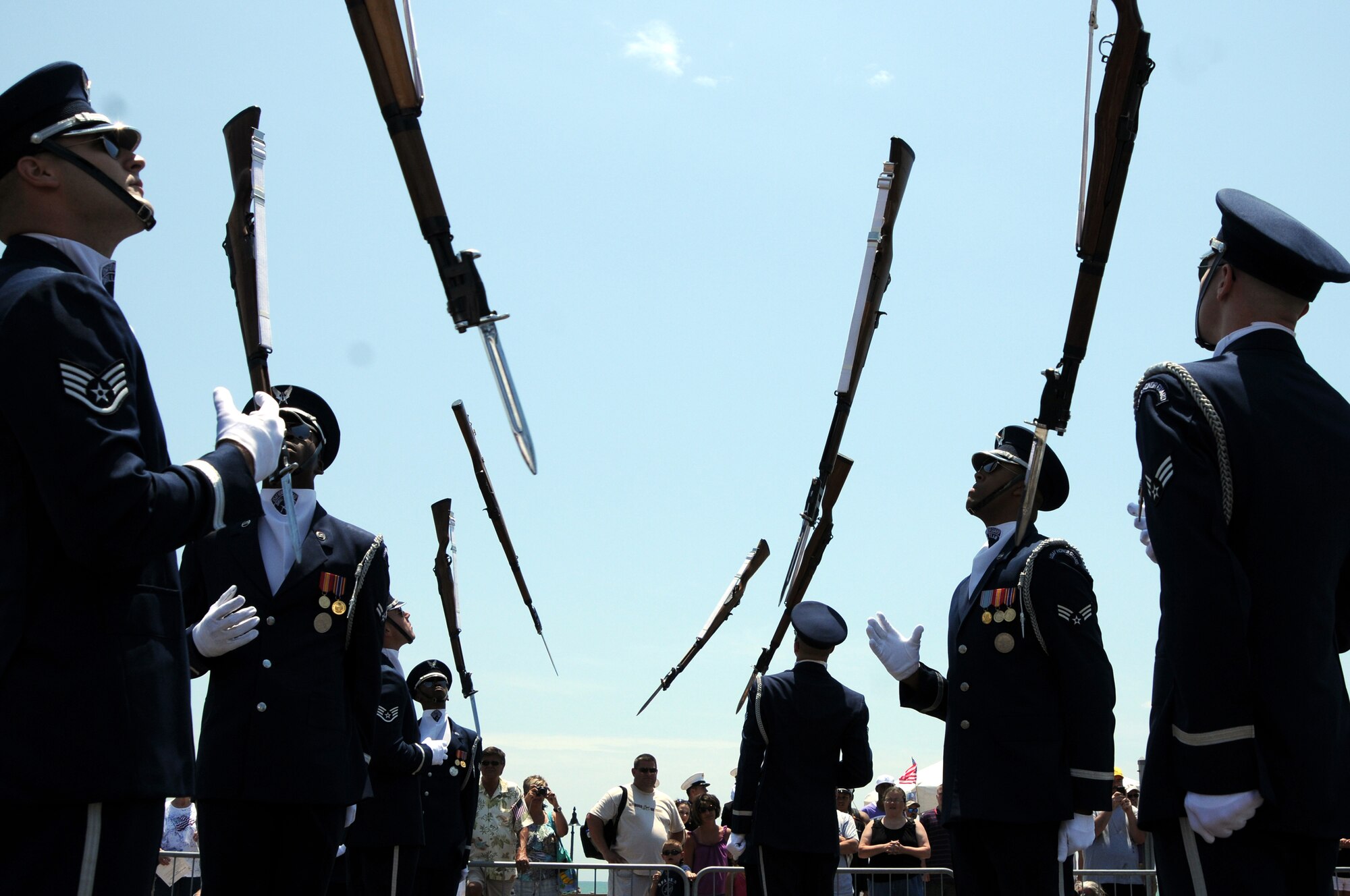 The U.S. Air Force Drill Team throws their M-1 rifles into the air May 28 for the Myrtle Beach, S.C., Memorial Day celebrations. In addition to the USAF Drill Team performing, the USAF Honor Guard parade flight marched in the parade down Ocean Boulevard. (U.S. Air Force photo by Airman 1st Class Tabitha N. Haynes)