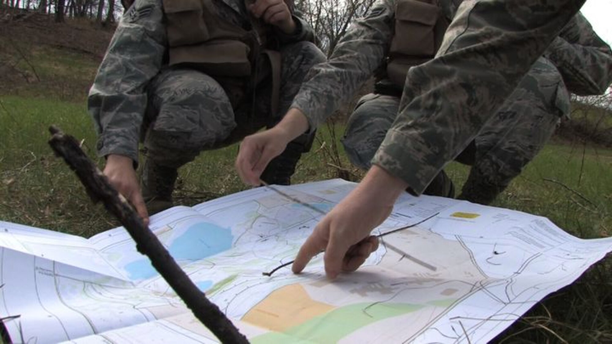 The 934th Operations Group, SERE (Search, Escape, Survival and Evasion) 

instructor, Staff Sgt. Adam Craft conducts survival skill techniques at the Arden 

Hills training area with aircrew members from the 934th Aeromedical 

Evacuation Squadron. Survival skills training is required for all aircrew members. (Air Force Photo/Wendy Cormier)

Their focus was prioritizing their needs, navigation and fire starting techniques.

