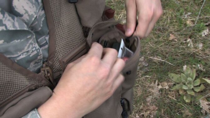 The 934th Operations Group, SERE (Search, Escape, Survival and Evasion) 

instructor, Staff Sgt. Adam Craft conducts survival skill techniques at the Arden 

Hills training area with aircrew members from the 934th Aeromedical 

Evacuation Squadron. Survival skills training is required for all aircrew members. (Air Force Photo/Wendy Cormier)

Their focus was prioritizing their needs, navigation and fire starting techniques.

