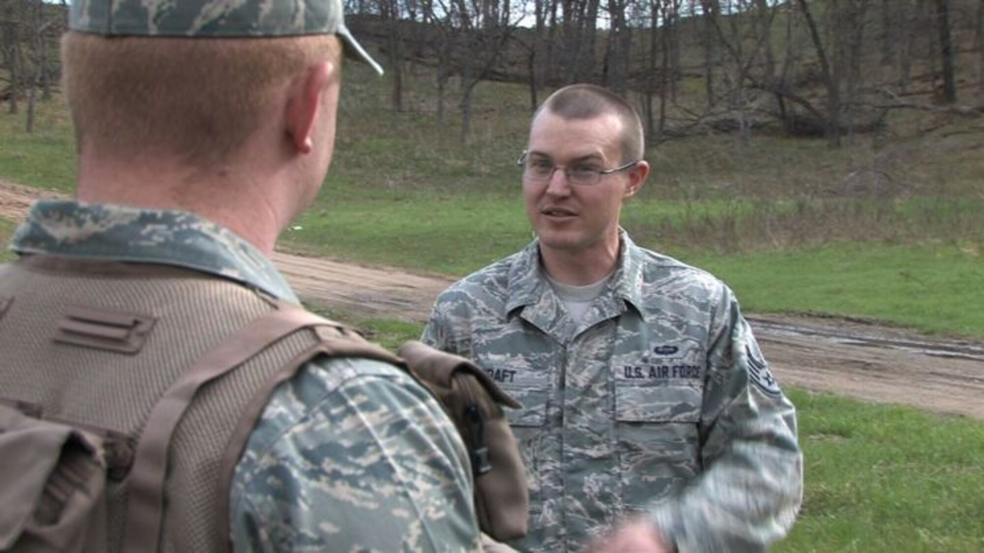 The 934th Operations Group, SERE (Search, Escape, Survival and Evasion) 

instructor, Staff Sgt. Adam Craft conducts survival skill techniques at the Arden 

Hills training area with aircrew members from the 934th Aeromedical 

Evacuation Squadron. Survival skills training is required for all aircrew members. (Air Force Photo/Wendy Cormier)

Their focus was prioritizing their needs, navigation and fire starting techniques.
