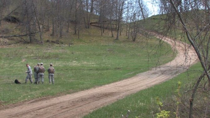 The 934th Operations Group, SERE (Search, Escape, Survival and Evasion) 

instructor, Staff Sgt. Adam Craft conducts survival skill techniques at the Arden 

Hills training area with aircrew members from the 934th Aeromedical 

Evacuation Squadron. Survival skills training is required for all aircrew members. (Air Force Photo/Wendy Cormier)

Their focus was prioritizing their needs, navigation and fire starting techniques.
