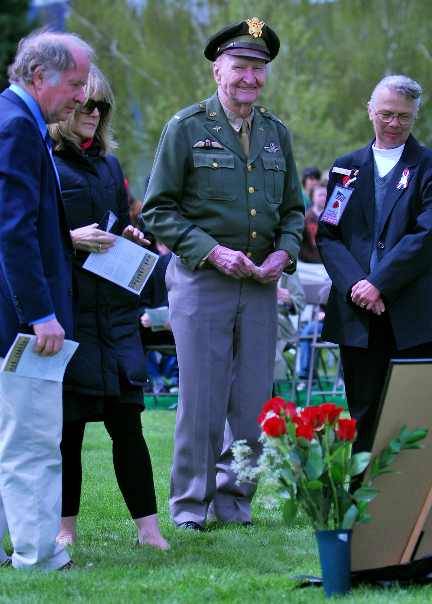 HAILEY, Idaho – Retired U.S. Air Force Col. Gail Halvorsen takes a moment prior to the Memorial Day service at the Hailey Cemetery to share a bit about the Berlin Airlift and view historical photos.  Colonel Halvorsen was a command pilot during the Berlin Airlift, and is better known as the “Candy Bomber” for air dropping candy to East German children.  More than 400 people, to include past and present military personnel, attended the 9th Annual Hailey Memorial Day ceremony, which was highlighted by a fly over of two A-10 Warthogs from the 124th Idaho Air National Guard. (U.S. Air Force photo by Master Sgt. Andrew Leonhard)