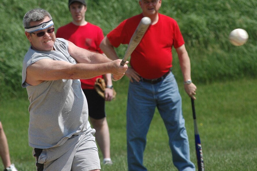 HANSCOM AIR FORCE BASE, Mass. - Greg MacDonnell hits a pitch during a Home Run Challenge game held at MITRE on May 26. The Battle Control Systems Division organized the challenge as part of a morale building event. (U.S. Air Force photo by Mark Herlihy)