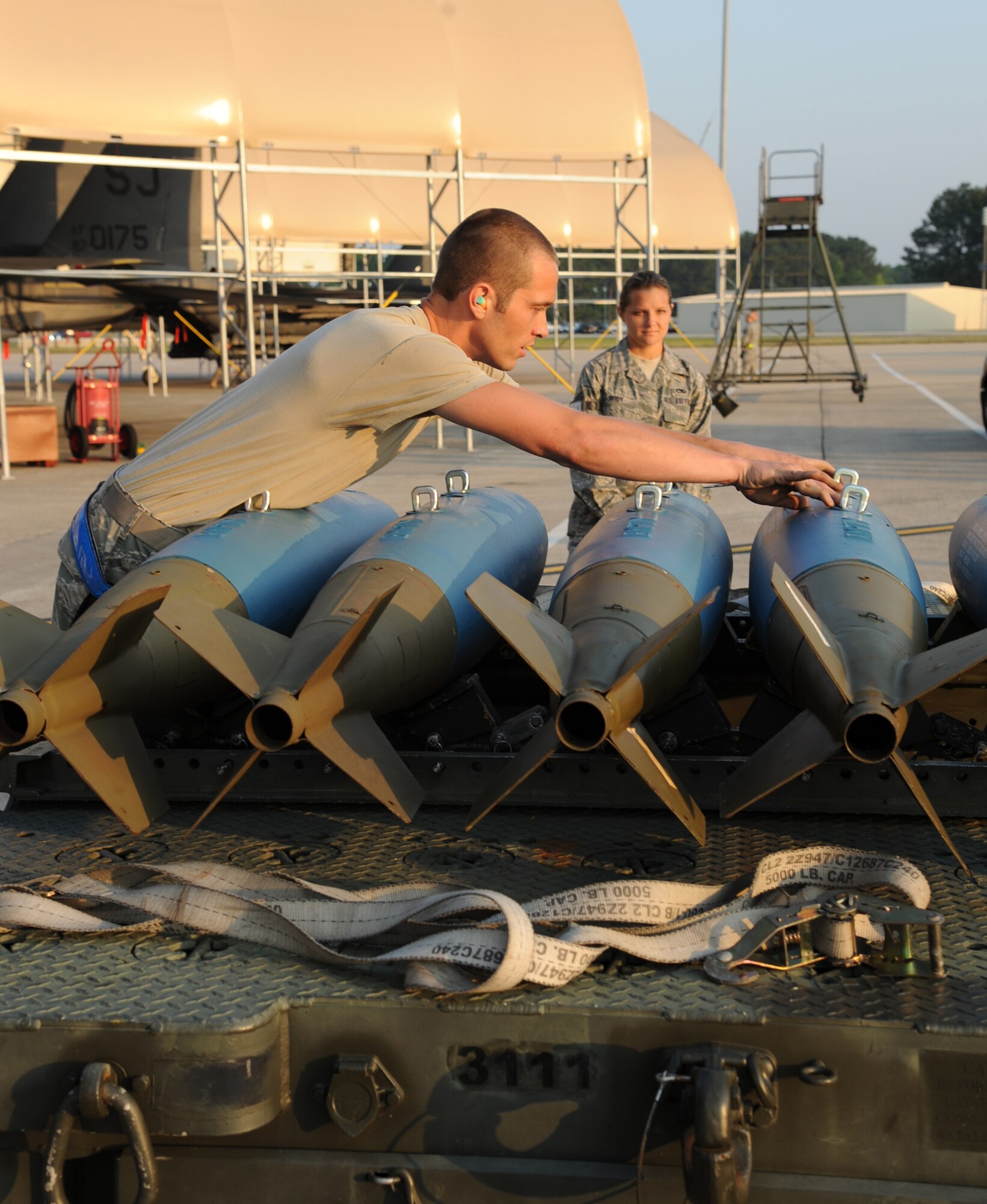 SEYMOUR JOHNSON AIR FORCE BASE, N.C.- Airman 1st Class Russell Pratt performs a serviceability check prior to loading weapons on an aircraft during a weapons load competition here, May 25, 2011. The event was part of the Wing Turkey Shoot competition which enhances espirt de corps within the weapons loading community. Airman Pratt hails from Jackson, Tenn., and is a 4th Aircraft Maintenance Squadron weapons load crew member.  (U.S. Air Force photo/Senior Airman Whitney Lambert)(RELEASED)