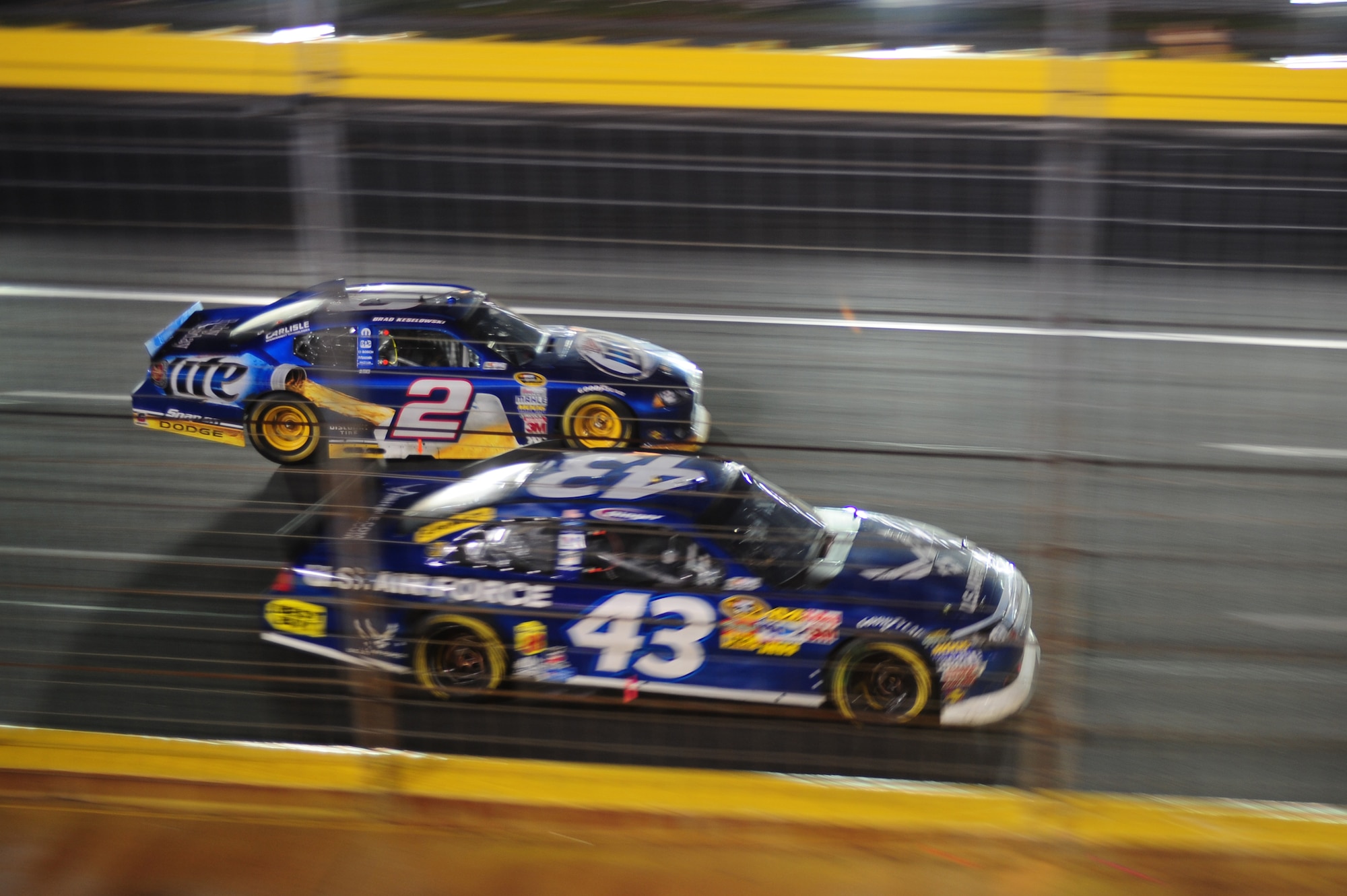 CHARLOTTE MOTOR SPEEDWAY, N.C. - A.J. Allmendinger, driver of the 43 U.S. Air Force Ford, races the number 2 Miller Lite Dodge of Kurt Busch back to the start/finish line during a caution here, May 29, 2011. The caution flag is flown if there is a hazard on the track; such as an accident, spilled fluids on the track or any kind of debris. Allmendinger finished 5th overall. (U.S. Air Force photo/Senior Airman Rae Perry)(RELEASED)
