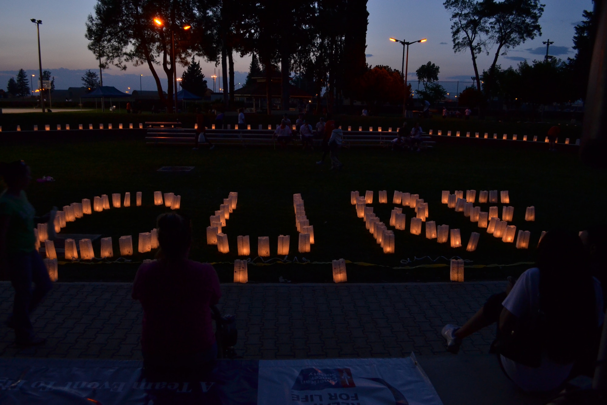 Luminary bags were distributed throughout Arkadas Park during the Relay for Life event as part of the ending ceremony May 21, 2011 at Incirlik Air Base, Turkey. Luminary bags are paper bags filled with sand and a candle to illuminate the bag. Incirlik raised $21,824 in contributions this year. The relay helped raise money for cancer research and cancer patients. The event is held to spread cancer awareness, celebrate the lives of survivors and remember those who lost their lives to cancer.  (U.S. Air Force photo by Staff Sgt. Alexandre Montes/ Released)