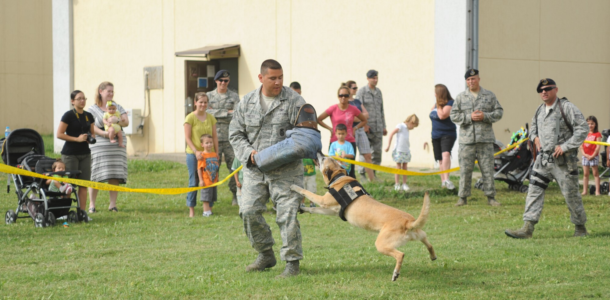 Tech. Sgt. Frederick Thiessen, from 39th Security Forces Squadron, and Loena, a Military Working Dog, demonstrate the K-9’s ability to neutralize a threat during a MWD demonstration May 18,2011 at Incirlik Air Base, Turkey.  The K-9 demonstration was one of multiple events hosted by the 39 SFS in observation of National Police Week. National Police Week was first observed in 1962 when President John F. Kennedy officially declared May 15 National Peace Officers' Memorial Day. (U.S. Air Force photo by Airman 1st Class Clayton Lenhardt/Released)
