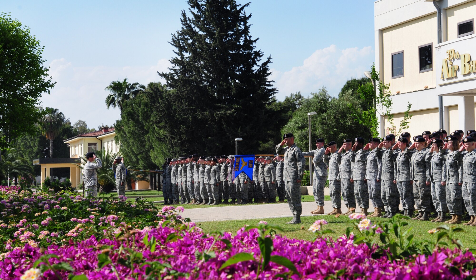 Airmen from the 39th Security Forces Squadron salute during a National Police Week retreat ceremony May 20, 2011 at Incirlik Air Base, Turkey.  The retreat ceremony was one of multiple events hosted by the 39 SFS in observation of National Police Week. National Police Week was first observed in 1962 when President John F. Kennedy officially declared May 15 National Peace Officers' Memorial Day.  (U.S. Air Force photo by Senior Airman Anthony Sanchelli/Released)