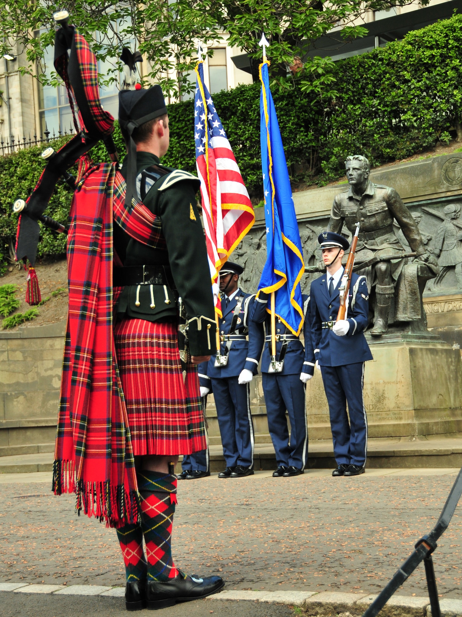 EDINBURGH, Scotland -- A bagpiper from the British Army's Royal Scots Dragoon Guards and the 48th Fighter Wing Honor Guard participate a Memorial Day ceremony honoring fallen heroes at the Scottish-American War Memorial in Edinburgh, Scotland on May 30. This year marks the 77th annual Scottish-American Memorial Day service at "The Call," a war memorial presented to the Scottish people by the U.S., as a tribute to World War I Scottish troops. (U.S. Air Force photo/ Staff Sgt. Megan P. Lyon)

