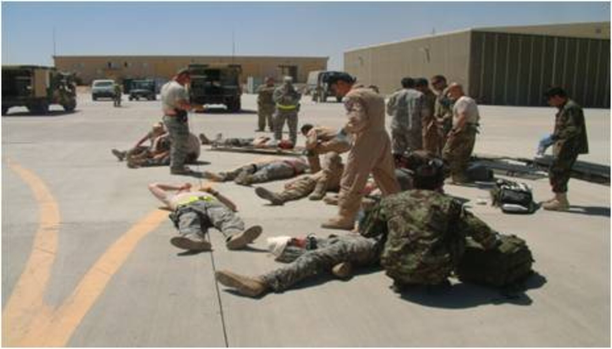 5/31/2011 – KANDAHAR, Afghanistan – Members of Kandahar Air Wing, 738th Air Expeditionary Advisory Group and Afghan Air Force participated in a mass casualty exercise here recently.  During the simulated exercise, Afghan medics provided prioritized medical triage to the wounded of a Mi-17 engine fire.  The exercise’s goal was to improve response time, demonstrate clear command and control while also evaluating the wing’s preparedness to manage a mass casualty situation.  (U.S. Air Force photo by Chief Master Sgt. Mark Long)