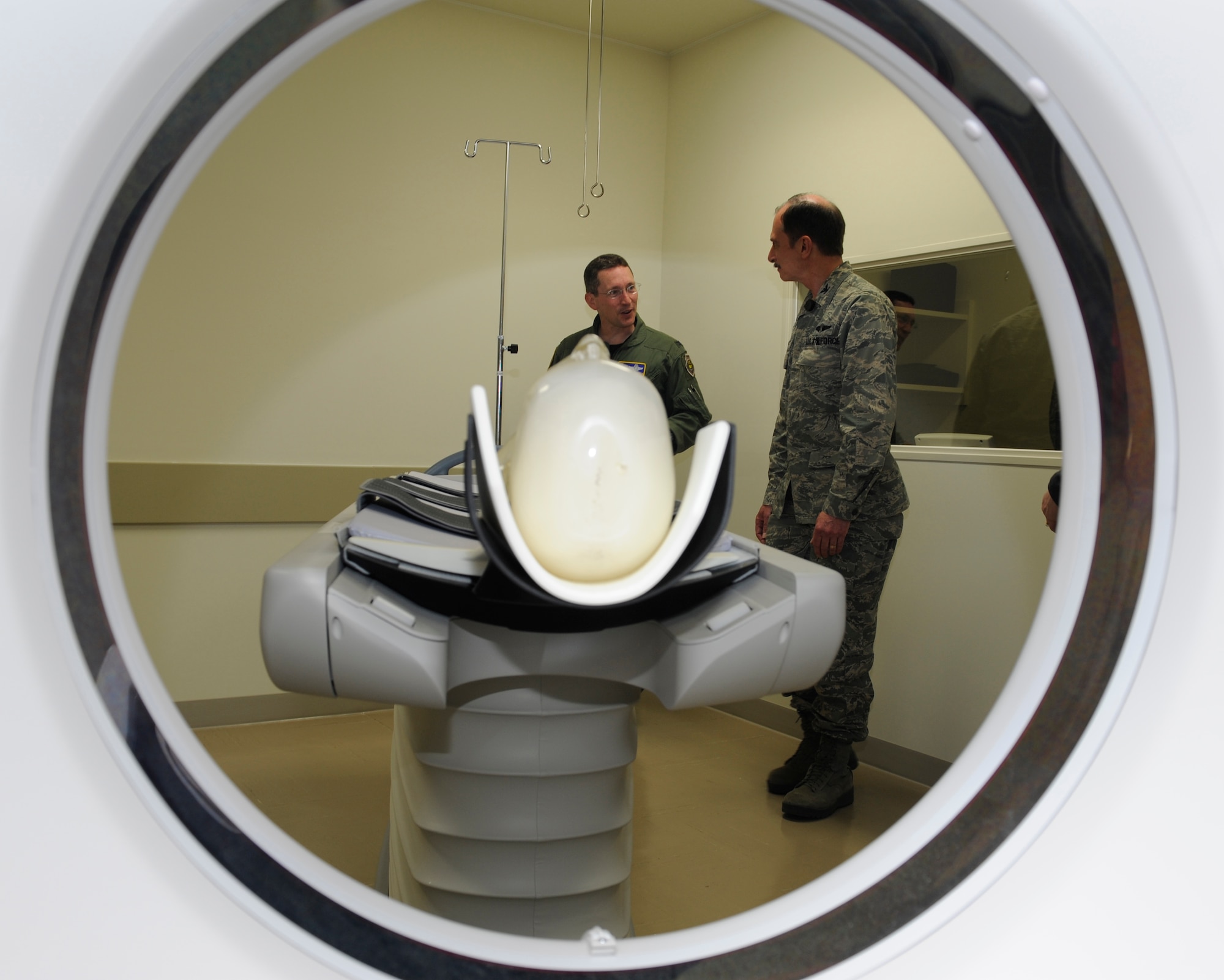 MISAWA AIR BASE, Japan -- Col. Michael Rothstein, 35th Fighter Wing commander, left, and Col. Terry Haske, 35th Medical Group commander, discuss the new CT scanner at the 35th MDG Diagnostic Imaging Department June 1. The CT scanner is a state-of-the-art device with powerful imaging and data processing capability that can produce 3-dimensional images of scanned body parts. (U.S. Air Force photo/Staff Sgt. Marie Brown/Released)
