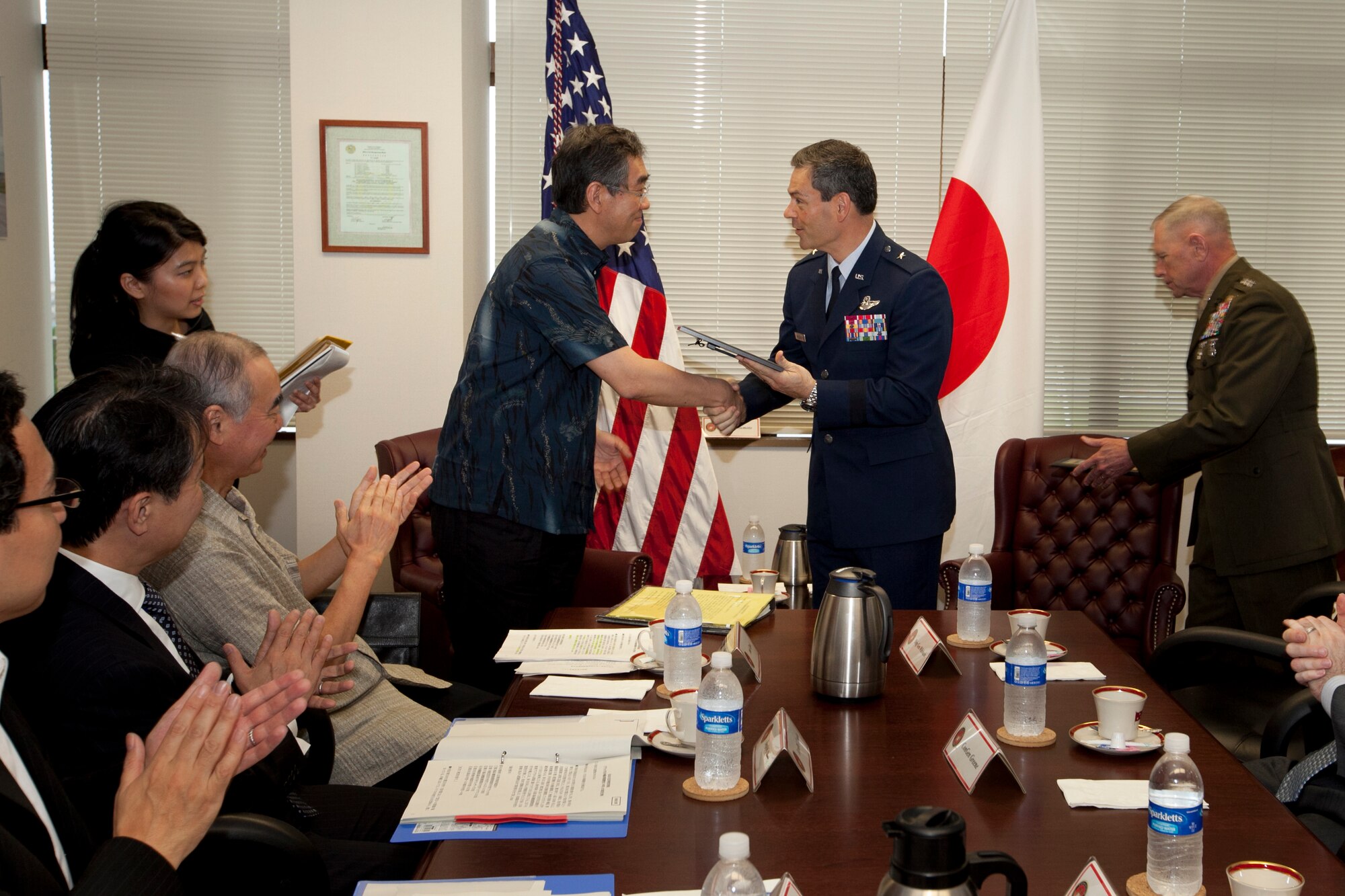 Takeaki Matsumoto, Japan Foreign Minister, recognizes U.S. Air Force Brig. Gen. Kenneth  S. Wilsbach, Commander of the 18th Wing, for his work during Operation Tomodachi, Marine Corps Camp Foster, Okinawa, Japan, May 28, 2011. Matsumoto met with U.S. Marine Lt. Gen. Kenneth J. Glueck Jr., III Marine Expeditionary Force commanding general and Marine Corps Bases Japan commander during his first visit to Okinawa since assuming office to discuss issues of mutual concern. (U.S. Marine Corps photo by Cpl. Patricia D. Lockhart/Released)
