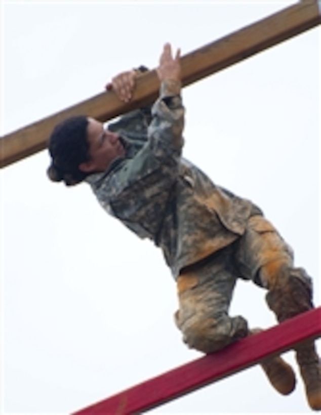 U.S. Army Sgt. Leah Serrano climbs up a tower ladder during the obstacle course segment of the U.S. Army Civil Affairs and Psychological Operations Command's Best Warrior Competition at Fort Bragg, N.C., on May 11, 2011.  Serrano, who is with the 352nd Civil Affairs Command, is among 14 soldiers participating in the four-day competition.  