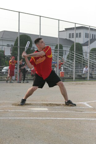Sam J. Graviet, ATC center fielder, swings at Devil Donkey’s pitch during an intramural softball game at the main softball field here June 2. ATC went on to win the game 13-2. A series of double and triples throughout the game along with good outfield play line drives helped to keep ATC in the lead. This was the fourth game of the season for both teams.