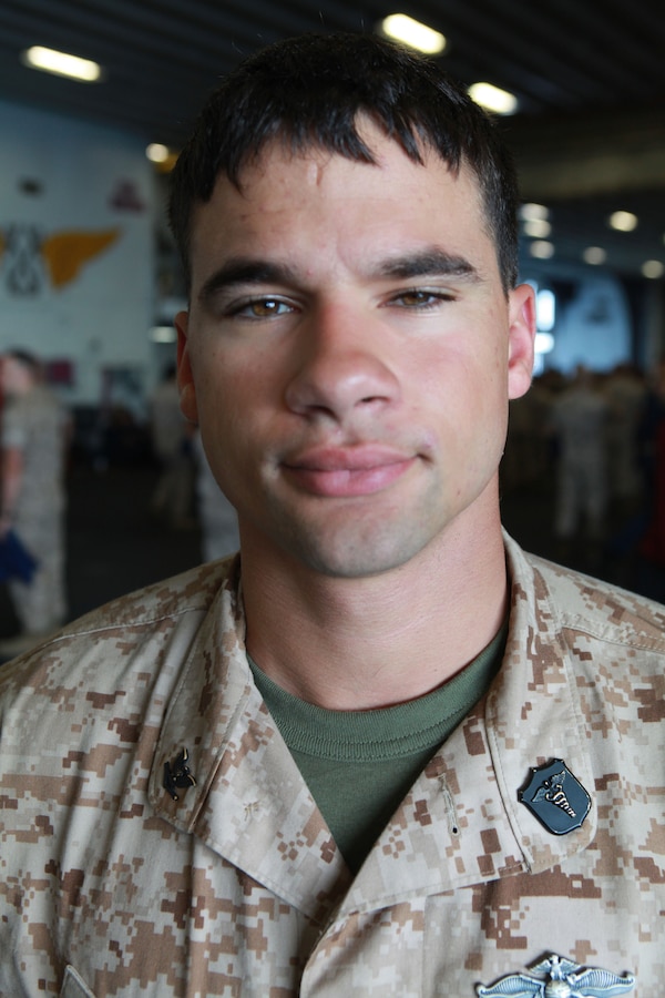 Petty Officer 3rd Class Christopher Frend a Fleet Marine Force hospital corpsman with Fox Company 2nd Battalion 9th Marine Regiment poses for a picture June 2 aboard the USS Iw the USS Iwo Jima (LHD -7) and USS New York (LPD-21) to take part and also honored those who have served by participating in various events during the Memorial Day weekend.