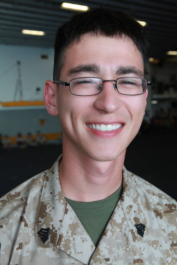 Sgt. David Steiner a data network specialist with 2nd Combat Logistics Battalion currently attached to the 24th Marine Expeditionary Unit poses f the USS Iwo Jima (LHD -7) and USS New York (LPD-21) to take part and also honored those who have served by participating in various events during the Memorial Day weekend.