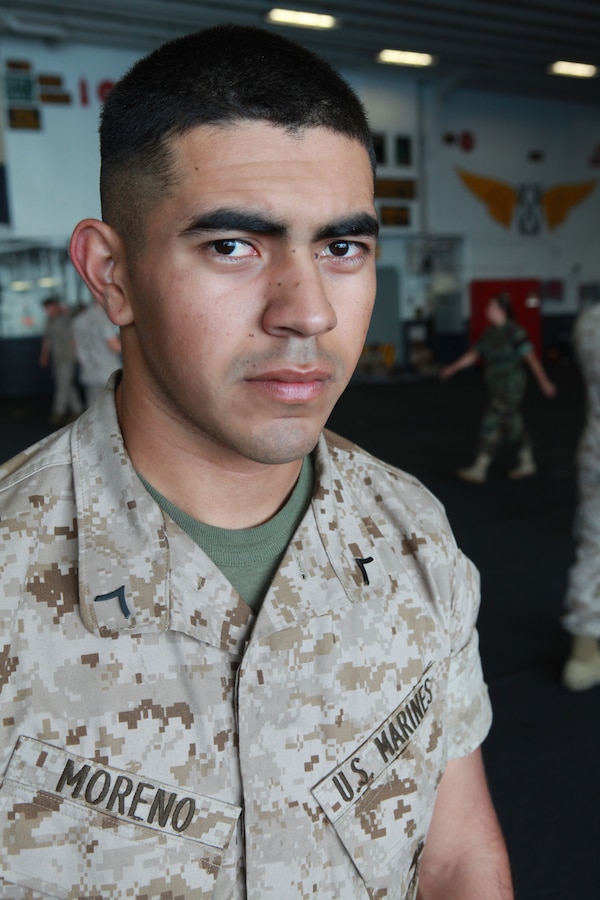 Pfc. Jamie Moreno tank crew man with 2nd Tank Battalion currently attached to the 24th Marine Expeditionary Unit poses f the USS Iwo Jima (LHD -7) and USS New York (LPD-21) to take part and also honored those who have served by participating in various events during the Memorial Day weekend.