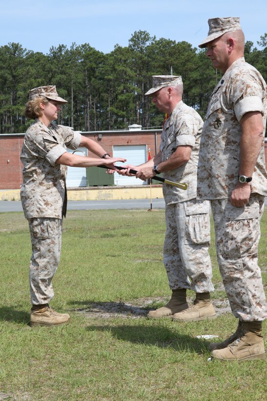 Col. Peter J. DeVine passes the sword of the sergeant major on to Sgt. Maj. Lisa K. Nilsson during a post and relief ceremony on the Marine Air Control Squadron 2 parade field June 3. “I am the enlisted advisor for the commanding officer. It entails everything that happens in the control group,” Nilsson explained. “I talk to the Marines, I find out what their issues are and I take it to the commanding officer, hopefully to come up with a solution to make their life better. I’m looking forward to being with the wing.