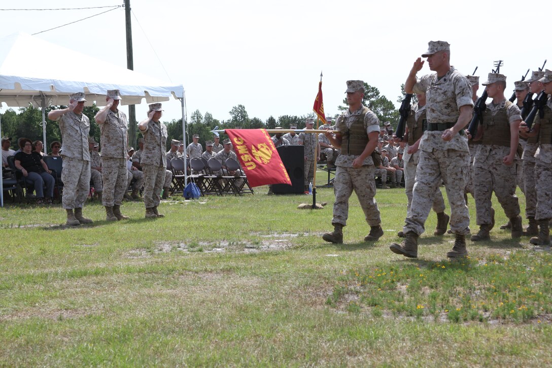 From left to right, Col. Peter J. DeVine, Sgt. Maj. Michael T. Sator and Sgt. Maj. Lisa K. Nilsson salute as the parade formation marches past on the Marine Air Control Squadron 2 parade field June 3. During the post and appointment ceremony, Sator stepped down as the Marine Air Control Group 28 sergeant major for Nilsson.