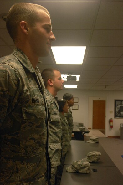Airmen stand at the position of parade rest as they prepare for a briefer to
enter the room at the First Term Airman Center June 3. FTAC is a nine-day
course designed to provide a structured program to transition airmen from a
training environment to the mission-oriented Air Force. (U.S. Air Force
photo/Senior Airman Allison M. Boehm)(RELEASED)
