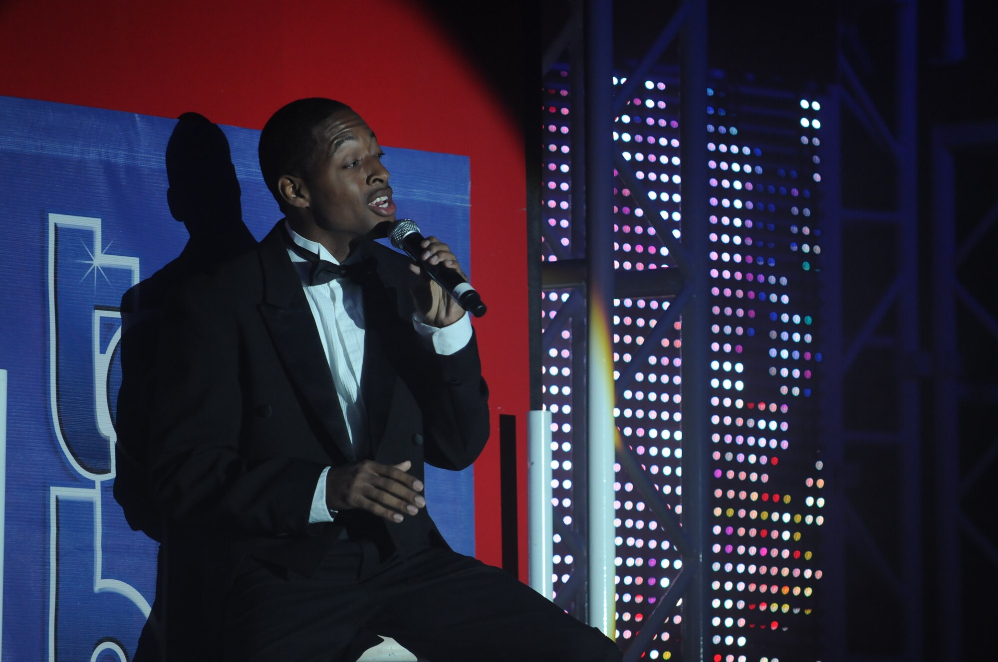 SAN ANGELO, Texas -- Tops in Blue vocalist, Staff Sgt. Derek Speights, performs in the 2011Tops in Blue Rhythm Nation show June 1 at the San Angelo Coliseum.  More than 1,100 people from Goodfellow and San Angelo gathered in the coliseum for the group’s free show which highlighted music throughout the past century.  This was the third stop of more than 60 locations planned for their 2011 world tour.  (U.S. Air Force photo/Staff Sgt. Heather L. Rodgers)
