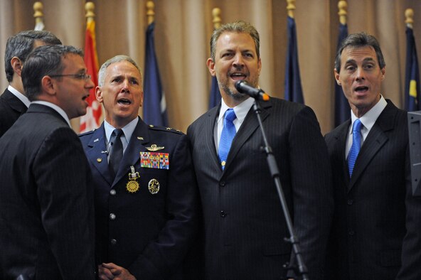 BARKSDALE AIR FORCE BASE, La. - Maj. Gen. Floyd Carpenter, former Eighth Air Force commander, sings "God Bless America" with the Blue Horizon Quartet during his retirement ceremony at Hoban Hall on Barksdale Air Force Base, La., June 3. General Carpenter served 33 years on active duty and has logged more than 3,000 flight hours in the B-52H Stratofortress. (U.S. Air Force photo by Airman 1st Class Micaiah Anthony)