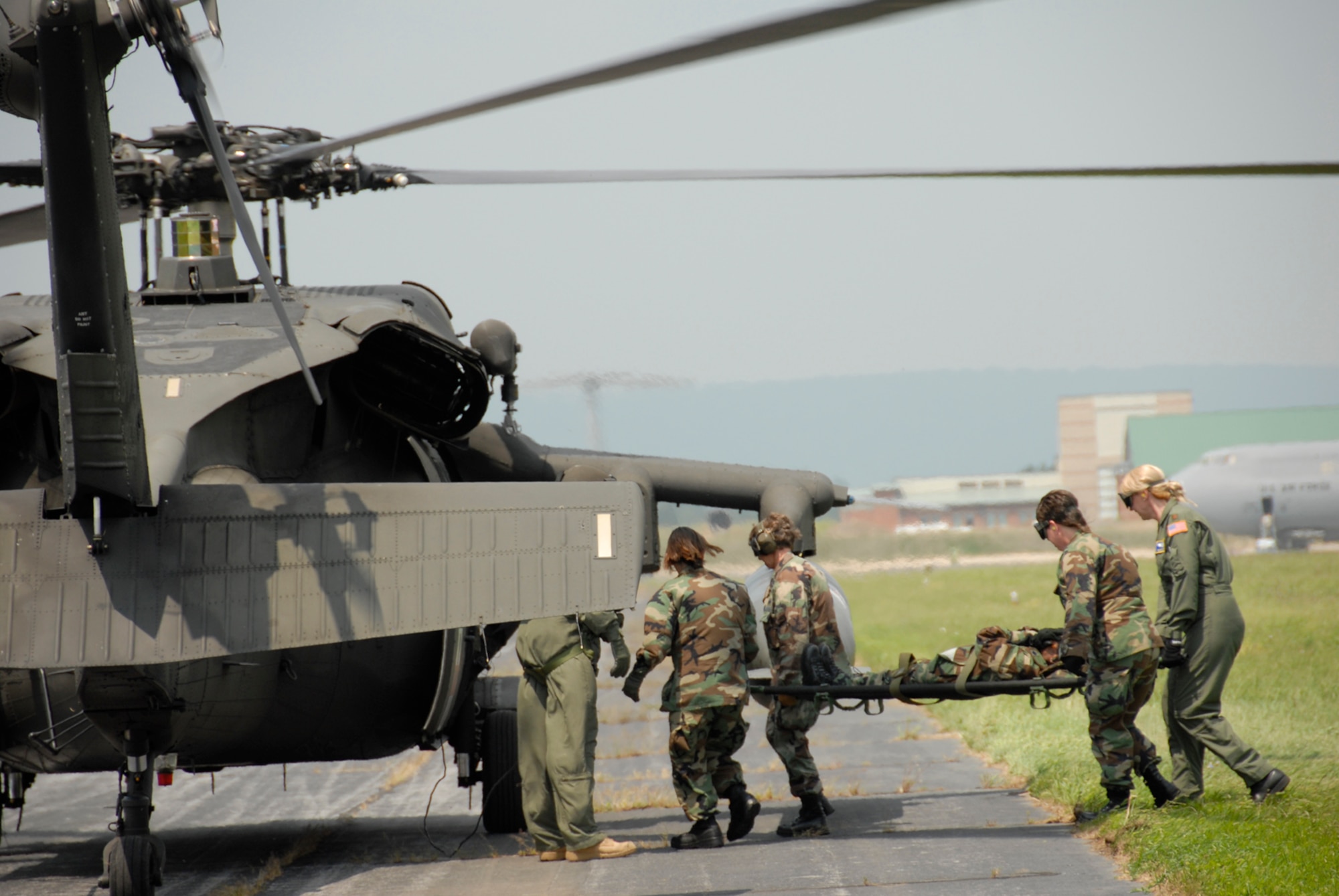 Members of the 167th Aeromedical Evacuation Squadron load a simulated patient aboard a UH-60 Black Hawk during a local training exercise, Martinsburg, W.Va., Aug. 2, 2008. Aeromedical members train loading and off-loading patients in various airframes and environments. (U.S. Air Force photo by Master Sgt. Emily A. Beightol-Deyerle)