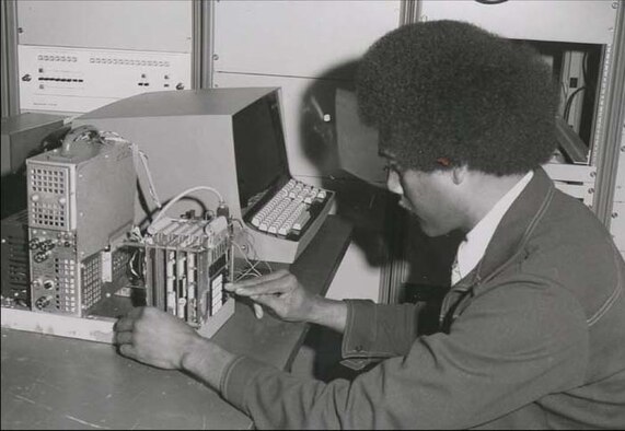 HOLLOMAN AIR FORCE BASE, N.M. -- George Gregory, current 746th Test Squadron Operations Flight chief, works with one of the first digital instrumentation systems to support laboratory and centrifuge testing using a Hewlett Packard 2100 computer in 1970 at the 746th TS headquarters. Mr. Gregory, who has worked in the 46th Test Group for 50 years, started working at the High Speed Test Track in 1961 before being transferred to the 46th Test Group’s guidance division in 1969. Over the course of his career, Mr. Gregory has worked with many strategic weapons systems such as the Atlas Missile, Minuteman Missile and Peacekeeper Missile systems. (Courtesy Photo)