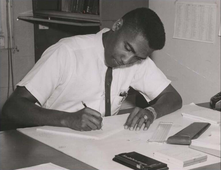 HOLLOMAN AIR FORCE BASE, N.M. -- George Gregory, current 746th Test Squadron Operations Flight chief, works on a calculation to develop an instrumentation solution for a rocket sled project in 1961 at the High Speed Test Track headquarters. Mr. Gregory worked at Holloman’s test track for the first eight of his 50 years with the 46th Test Group. While working at the test track, one of Mr. Gregory’s first assignments was to provide instrumentation support for the evaluation of the Atlas Missile’s inertial navigation system. (Courtesy Photo)