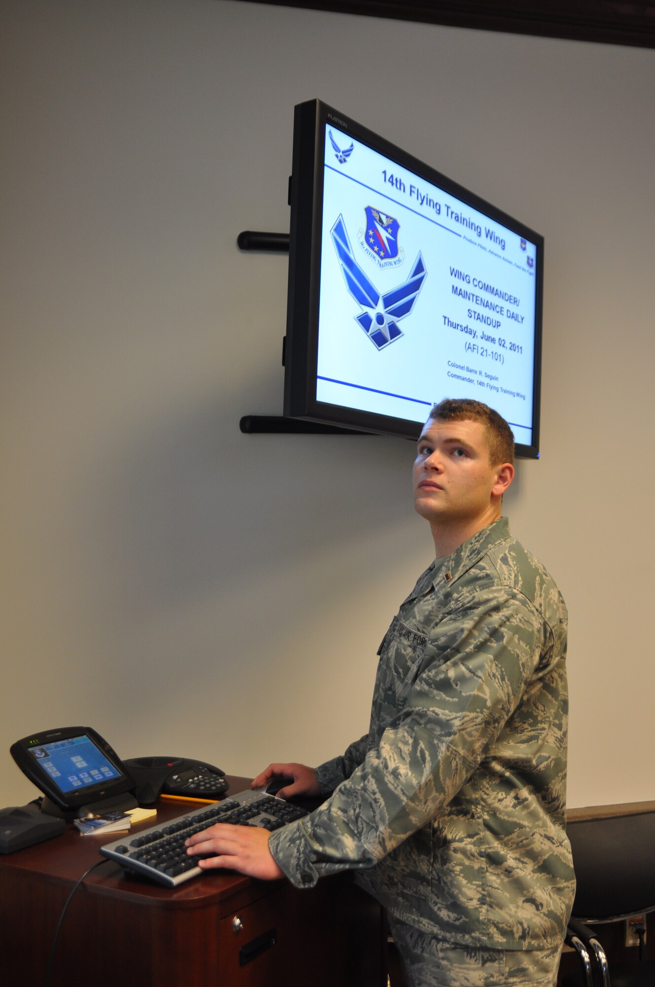 2nd Lt. Andy Waddel, a transition lieutenant current working as a 14th Flying Training Wing Commander's Action Group Assistant, prepares a presentation in the Wing Conference Room on June 2.