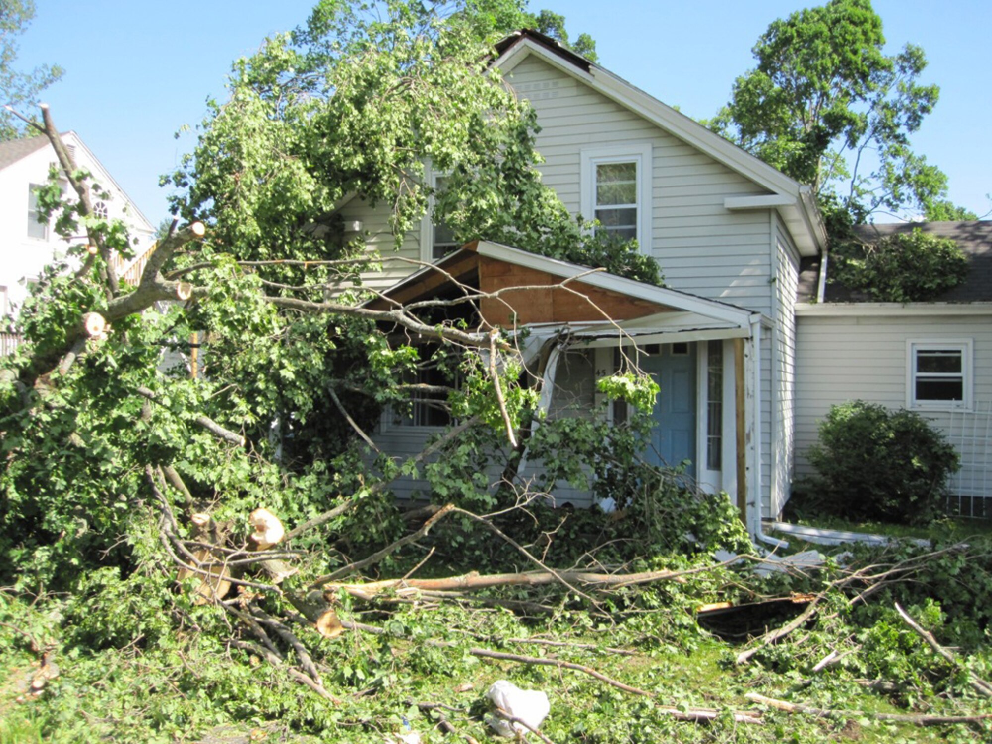 A house in Monson, Mass., shows the aftermath of a tornado that ripped through the area June 1, 2011. Firefighters from Westover Air Reserve Base, Mass., performed search and rescue the next day in Monson after two tornadoes left widespread damage in 19 communities across the area. (Courtesy photo/Capt. Robert Mancini)
					
