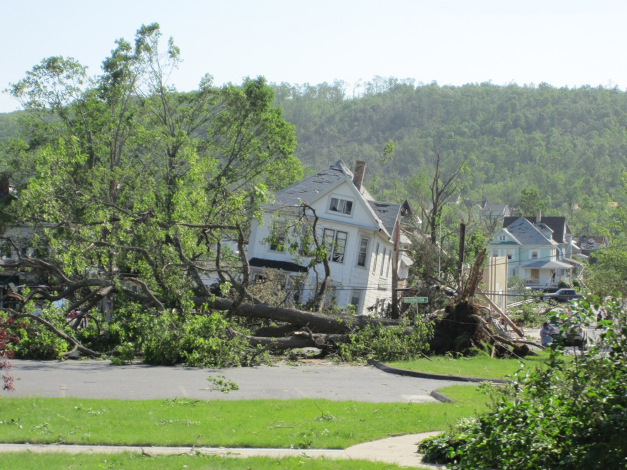 A house in Monson, Mass., shows the aftermath of a tornado that ripped through the area June 1, 2011. Firefighters from Westover Air Reserve Base, Mass., performed search and rescue the next day in Monson after two tornadoes left widespread damage in 19 communities across the area. (Courtesy photo/Capt. Robert Mancini)
					
