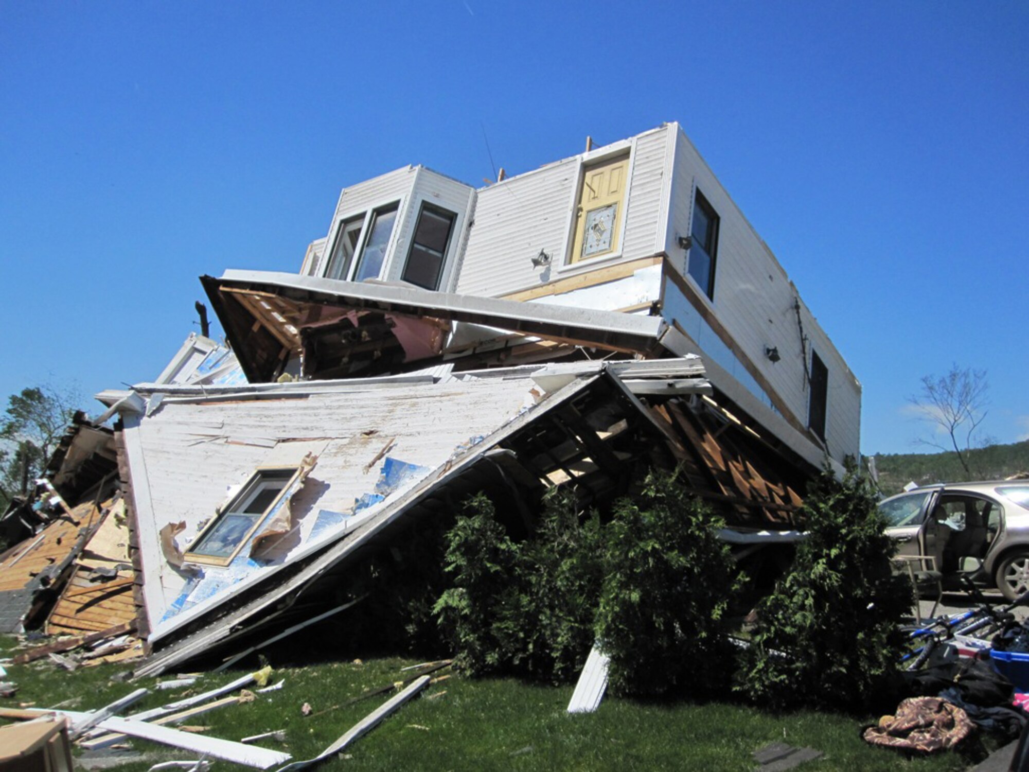 A home in Monson, Mass., shows the aftermath of a tornado that ripped through the area June 1, 2011. Firefighters from Westover Air Reserve Base, Mass., performed search and rescue the next day in Monson after two tornadoes left widespread damage in 19 communities across the area. (Courtesy photo/Capt. Robert Mancini)					