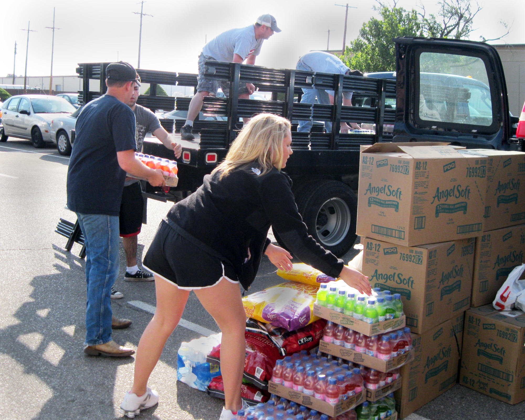 Volunteers at Altus Air Force Base load a flat bed truck with donated items for Joplin, Mo. residents, May 27, 2011. The city of Joplin was devastated by a tornado May 22. (Courtesy photo)                      