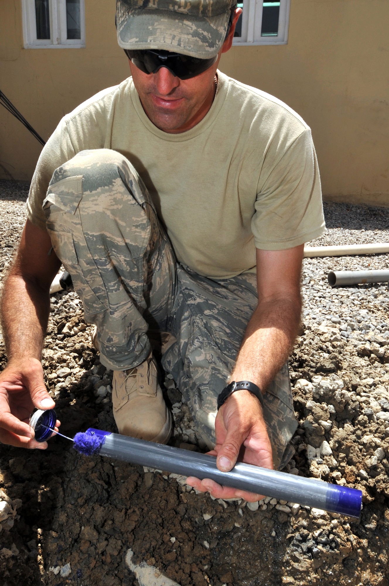Staff Sgt. Travis King applies a primer prior to connecting pipes May 23, 2011, at a combat outpost in Afghanistan. Sergeant King is a utility system craftsman assigned to the 577th Expeditionary Prime Base Engineer Emergency Force Squadron. (U.S. Air Force photo/Senior Airman Sheila deVera)
