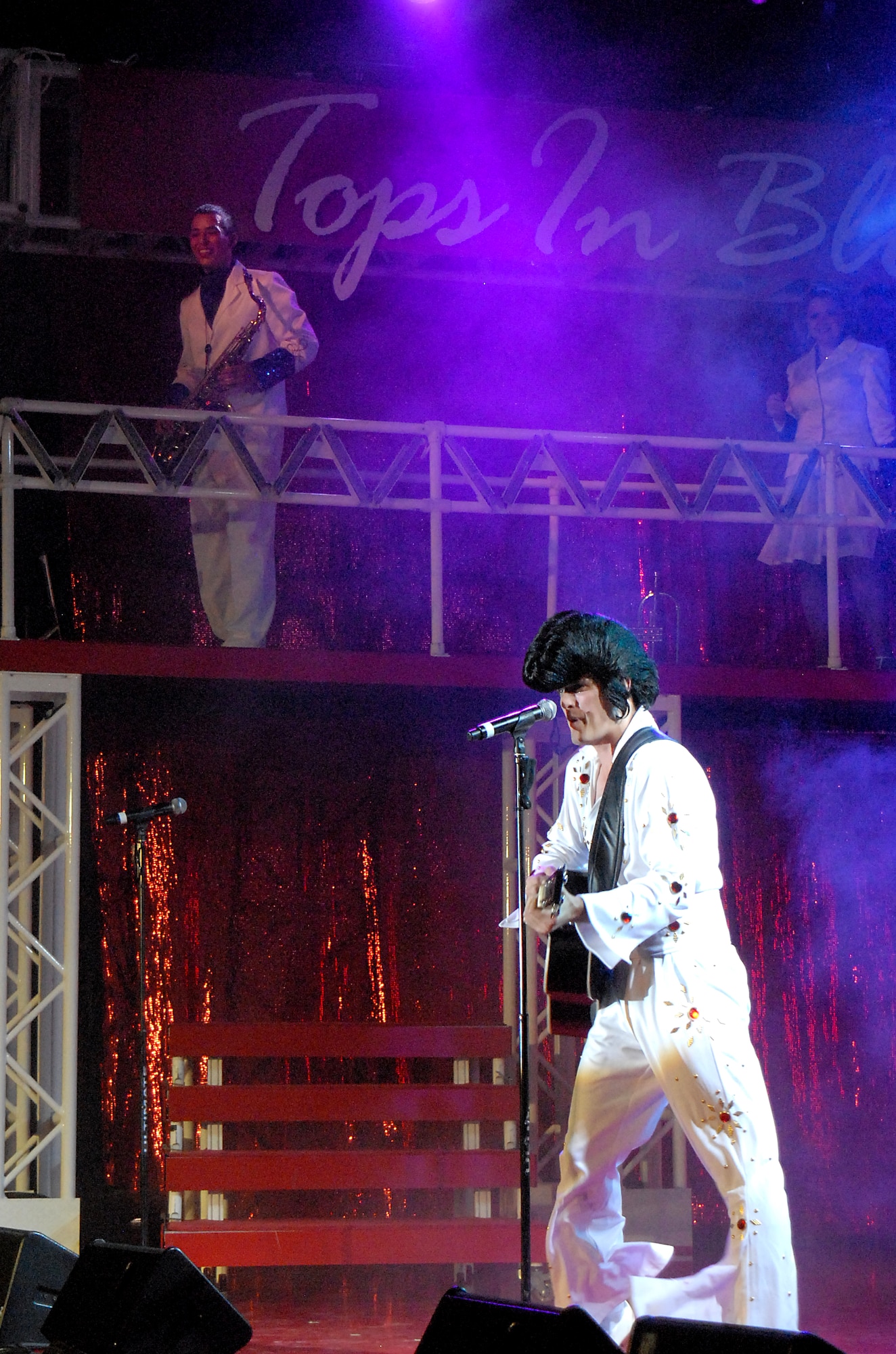 SAN ANGELO, Texas-- Senior Airman Cordero Nichols, Tops in Blue 2011 vocalist, dresses up as the “King of Rock and Roll”, Elvis Presley, for his performance at the San Angelo Coliseum June 1. San Angelo was the third stop on their 2011 tour list, which includes a variety of stateside bases, Europe, and even Asia. (U.S. Air Force photo/Airman 1st Class Michael Smith) 