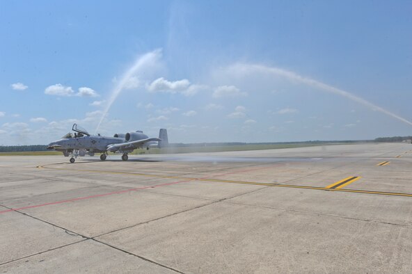 Col. William DeMaso, 23rd Wing vice commander, is showered by fire trucks after taking his final flight at Moody Air Force Base, Ga. June 2. Colonel DeMaso will be retiring after 24 years of military service. (U.S Air Force photo/Airman 1st Class Paul Francis)(RELEASED)
