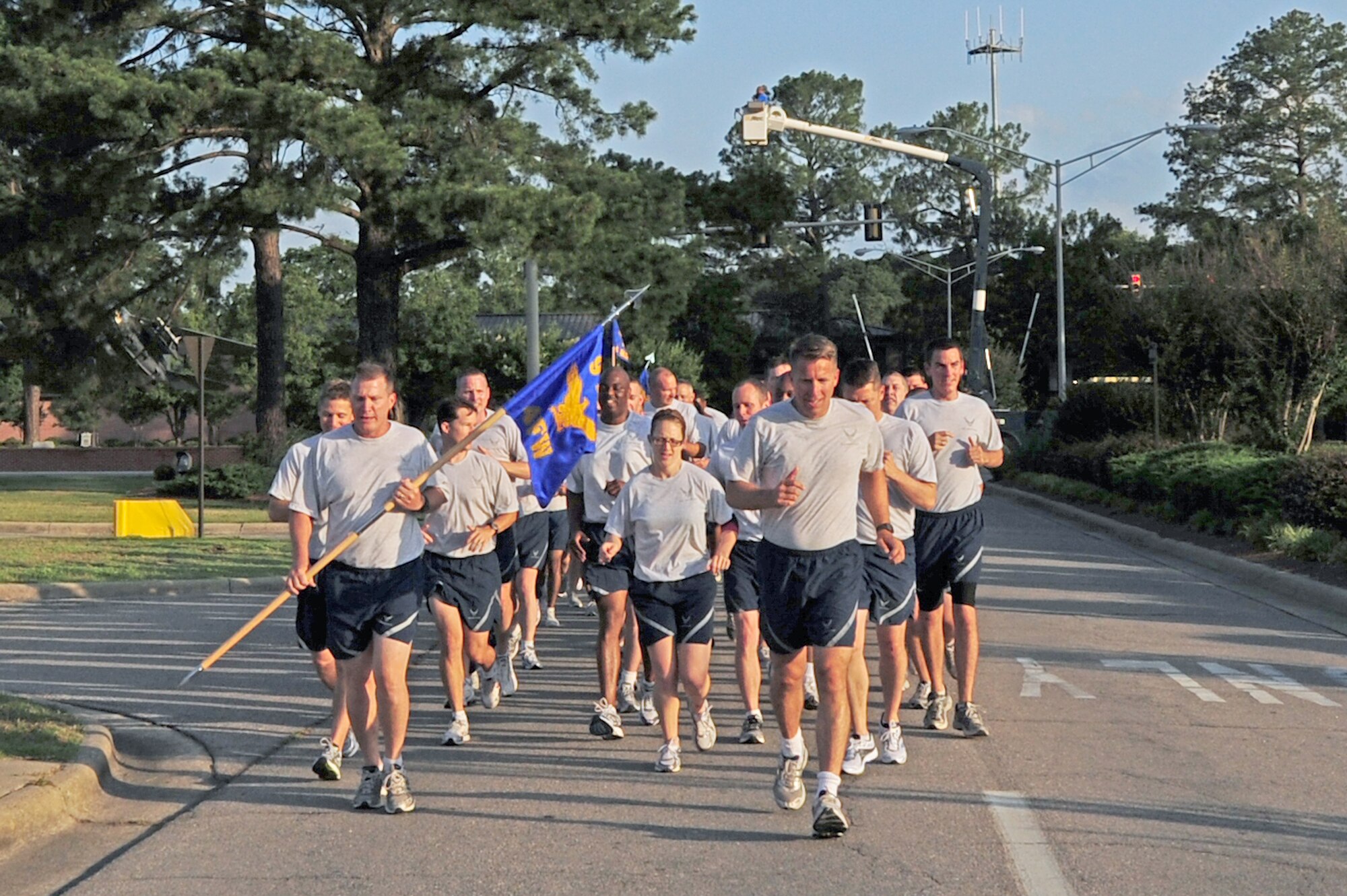 SEYMOUR JOHNSON AIR FORCE BASE, N.C. - Col. Patrick Doherty, 4th Fighter Wing commander, and Command Chief Master Sgt. Blake Malpass set the pace for the wing run here June 3, 2011. The wing run kicked off Wing Sports Day, a day of events designed to boost morale and team work. (U.S. Air Force photo/Senior Airman Rae Perry) (RELEASED)