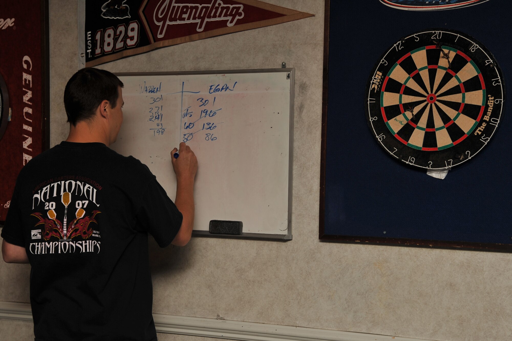 SEYMOUR JOHNSON AIR FORCE BASE, N.C.-Tech. Sgt. Richard Egan updates his score during the darts tournament as part of Wing Sports Day here, June 3, 2011. Sergeant Egan made it to the finals after three competitive rounds.  Sergeant Egan is a 372nd Training Squadron field training instructor, and a native of Omaha, Neb. (U.S. Air Force photo/Senior Airman Whitney Lambert)(RELEASED)