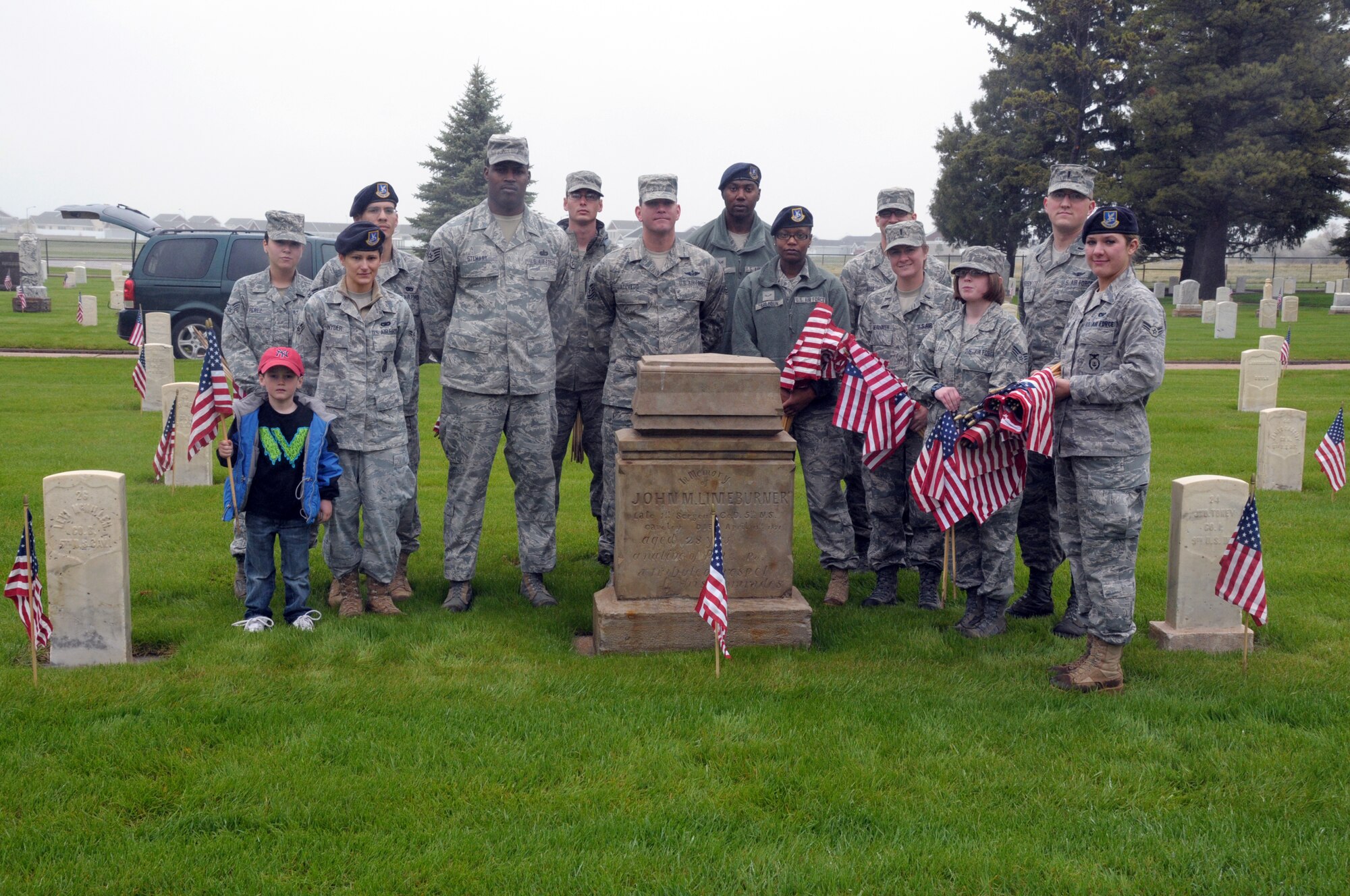 Members of Warren’s Base Honor Guard placed flags at each of the graves in the cemetery to remember the sacrifices of those who served before. (U.S. Air Force photo by Blaze Lipowski)